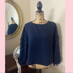 navy blue office blouse with feather sleeves; mid/long sleeve length